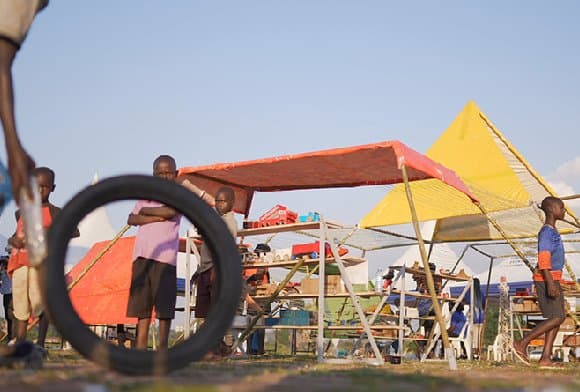 Colorful angular tents shaped, puzzle-like zanya pavilion in Northern Uganda